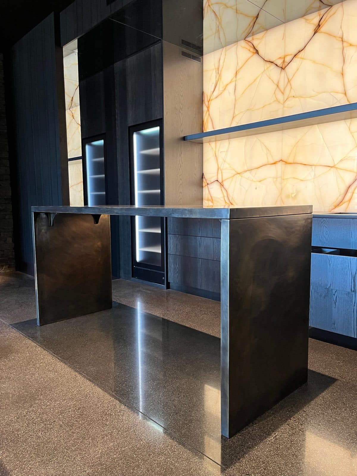 End view of the bronze bar showing the cast corner brackets